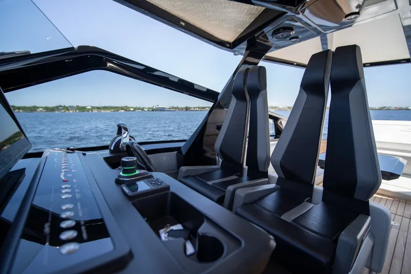 Slide: The Image of Interior view of 2022 Wally wallytender43X yacht cockpit with sleek seating and controls. - 7