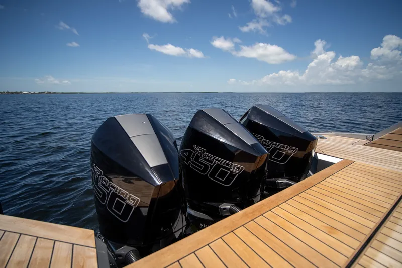 Slide: The Image of Triple outboard engines on a 2022 Wally wallytender43X yacht, cruising on open water. - 30
