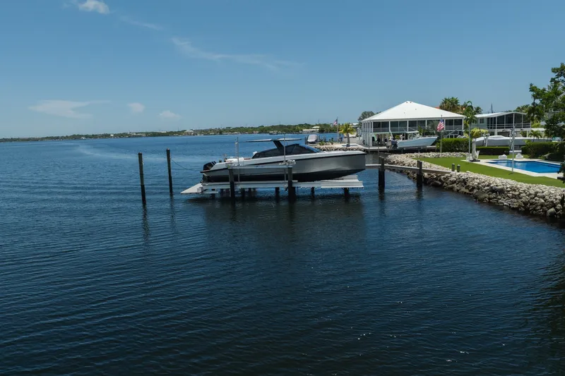 Slide: The Image of 2022 Wally wallytender43X yacht docked by waterfront home. - 70