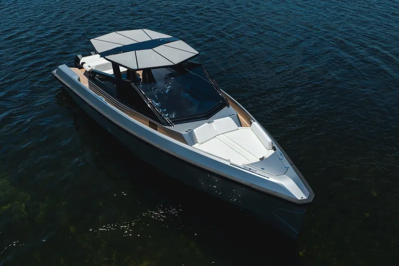 Slide: The Image of 2022 Wally wallytender43X luxury yacht on calm water, featuring sleek design and modern canopy. - 39