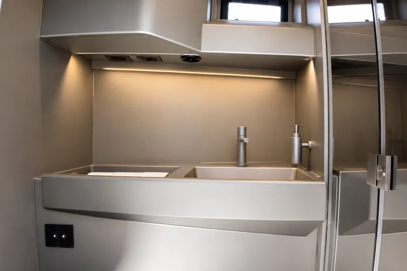 Slide: The Image of Modern bathroom sink in 2022 Wally wallytender43X yacht, featuring sleek design and ambient lighting. - 19