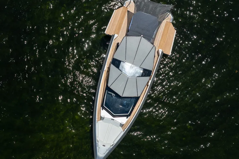 Slide: The Image of Overhead view of 2022 Wally wallytender43X yacht on shimmering water. - 63