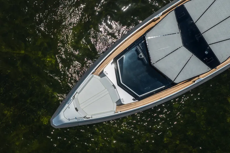 Slide: The Image of Aerial view of 2022 Wally wallytender43X yacht on shimmering water. - 35