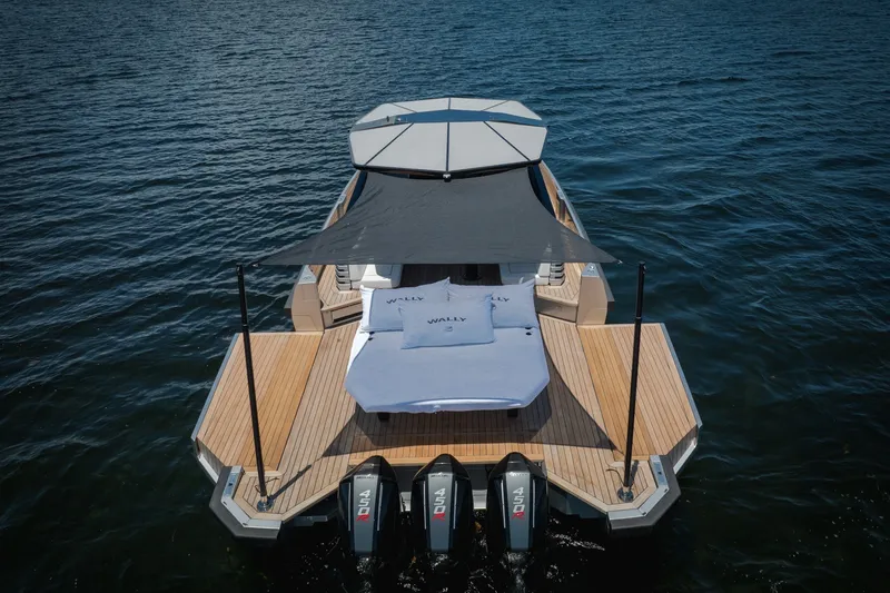 Slide: The Image of 2022 Wally wallytender43X luxury yacht with sunshade and triple engines on open water. - 13