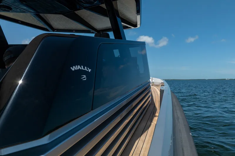 Slide: The Image of 2022 Wally wallytender43X yacht cruising on open water under clear blue sky. - 68