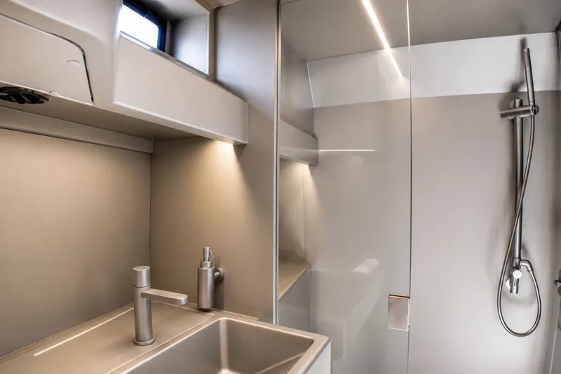 Slide: The Image of Modern bathroom interior of 2022 Wally wallytender43X yacht, featuring sleek sink and shower. - 20
