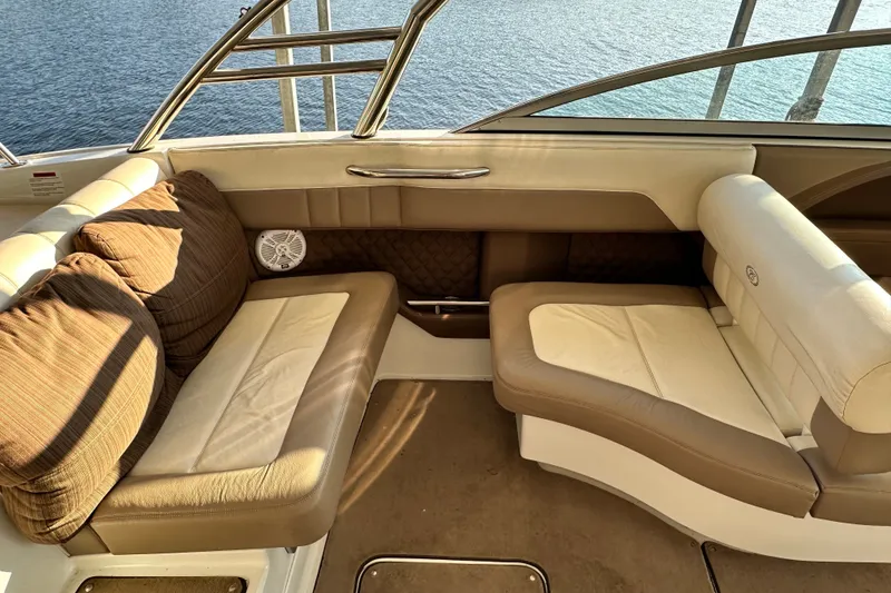 Slide: The Image of Luxurious seating area on a 2010 Cobalt 296 boat, overlooking serene water. - 10