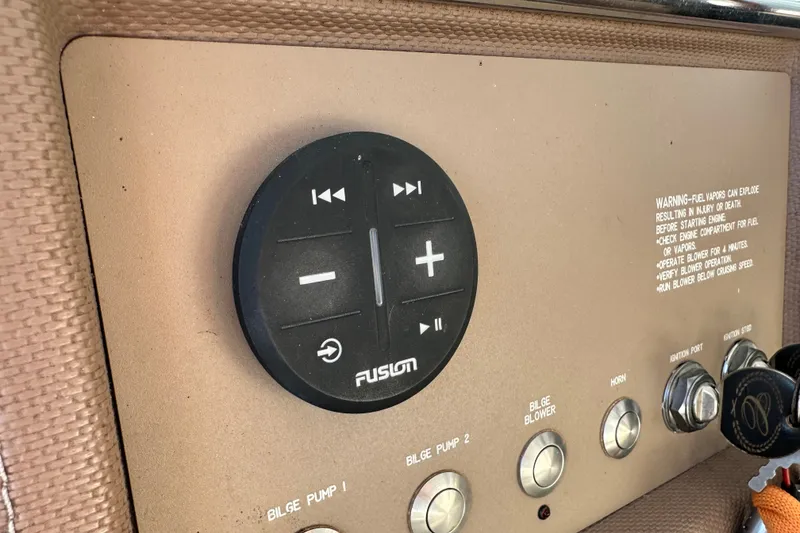 Slide: The Image of Control panel of a 2010 Cobalt 296 boat with Fusion audio system. - 16