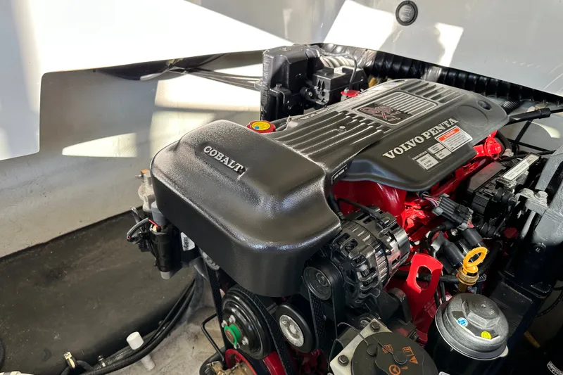 Slide: The Image of Engine compartment of a 2010 Cobalt 296 boat featuring a Volvo Penta engine. - 21