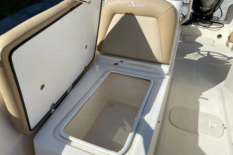 Slide: The Image of 2021 Scout 175 Sport Dorado boat interior with open storage compartment. - 16