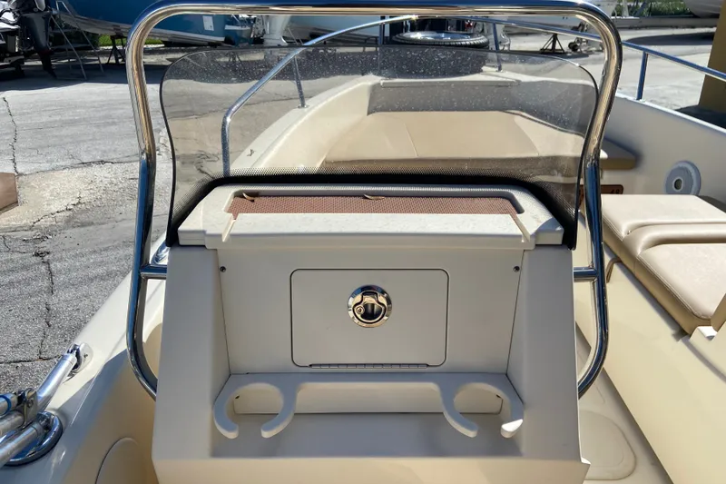 Slide: The Image of 2021 Scout 175 Sport Dorado boat interior with windshield and seating area. - 7