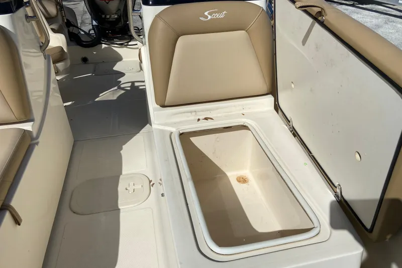 Slide: The Image of 2021 Scout 175 Sport Dorado boat interior with open storage compartment. - 15