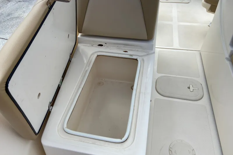 Slide: The Image of Open storage compartment on 2021 Scout 175 Sport Dorado boat interior. - 14