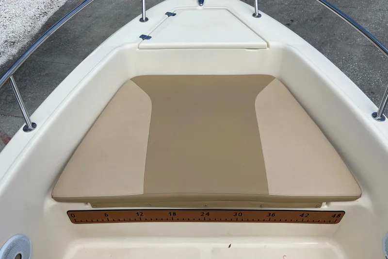 Slide: The Image of 2021 Scout 175 Sport Dorado boat bow with cushioned seating and measurement markings. - 17