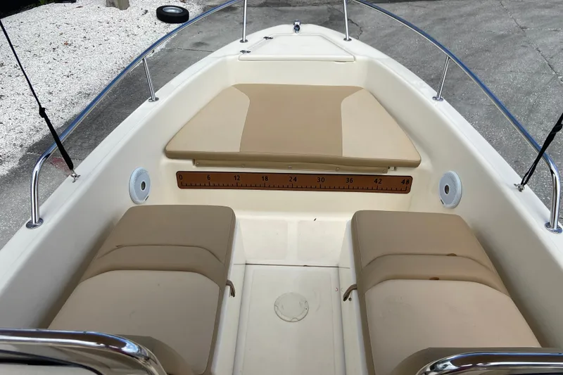 Slide: The Image of 2021 Scout 175 Sport Dorado boat interior with beige seating and measurement scale. - 12