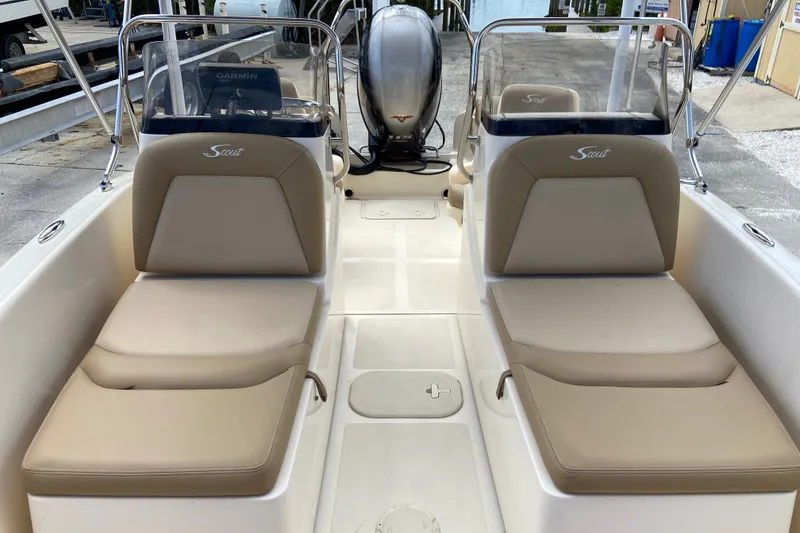Slide: The Image of 2021 Scout 175 Sport Dorado boat interior with beige seating and console. - 13