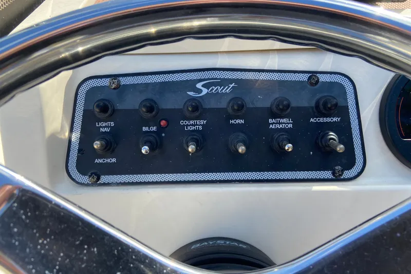 Slide: The Image of Control panel of a 2021 Scout 175 Sport Dorado boat with labeled switches. - 10