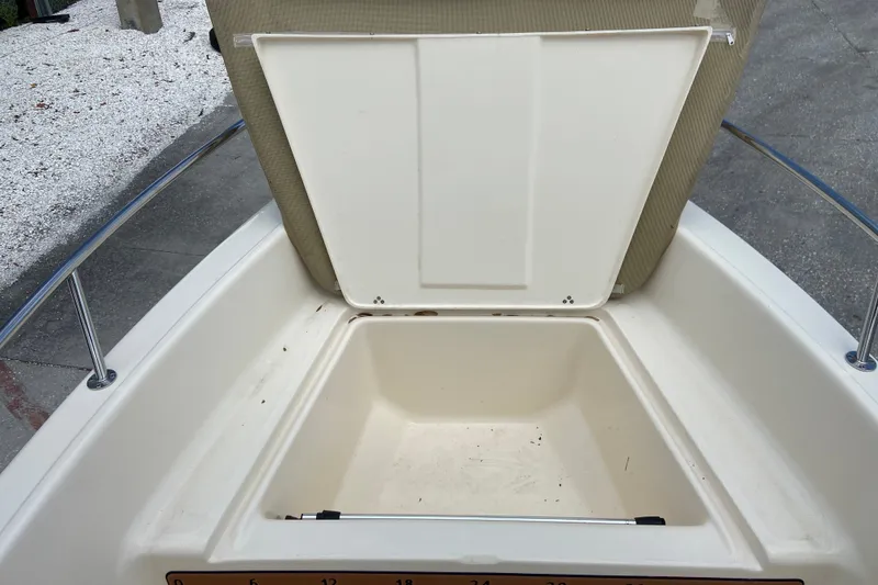 Slide: The Image of Open storage compartment on a 2021 Scout 175 Sport Dorado boat. - 16