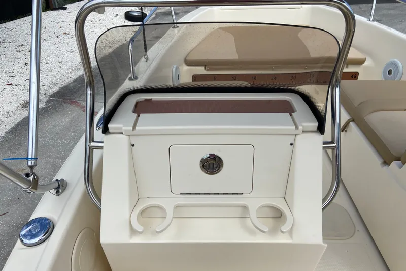 Slide: The Image of 2021 Scout 175 Sport Dorado boat console with storage and cup holders. - 7