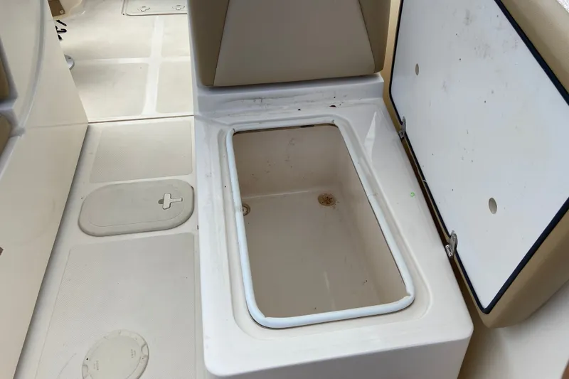 Slide: The Image of Open storage compartment on 2021 Scout 175 Sport Dorado boat interior. - 15