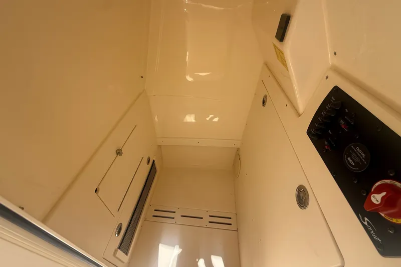 Slide: The Image of Interior view of 2027 Scout 220 XSF boat cabin with control panel. - 17