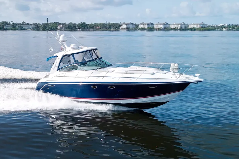 Slide: The Image of 2008 Formula 40 Performance Cruiser speeding on calm water, showcasing sleek design and power. - 67
