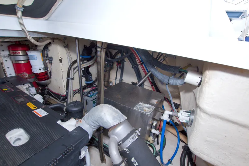 Slide: The Image of Engine compartment of a 2008 Formula 40 Performance Cruiser with visible wiring and components. - 63