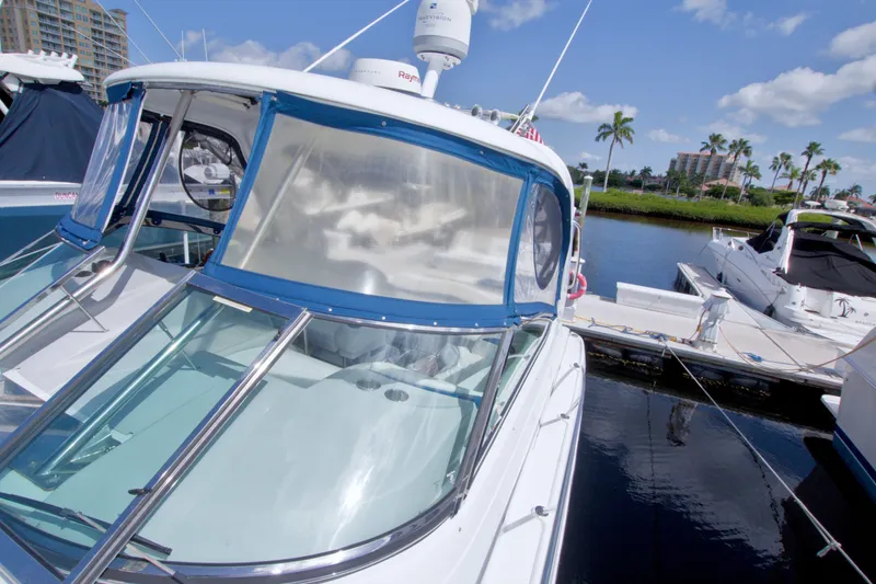 Slide: The Image of 2008 Formula 40 Performance Cruiser docked at marina under clear blue sky. - 28