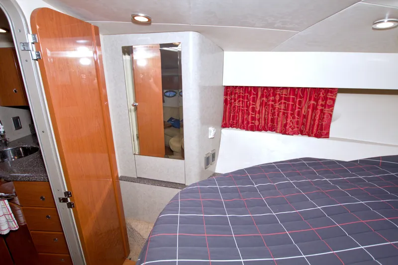 Slide: The Image of Interior of 2008 Formula 40 Performance Cruiser with bed, mirror, and wooden cabinetry. - 36