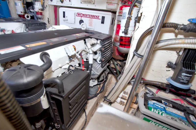 Slide: The Image of Engine room of a 2008 Formula 40 Performance Cruiser with Westerbeke generator and various components. - 65