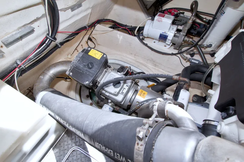 Slide: The Image of Engine compartment of a 2008 Formula 40 Performance Cruiser, showcasing mechanical components and wiring. - 60