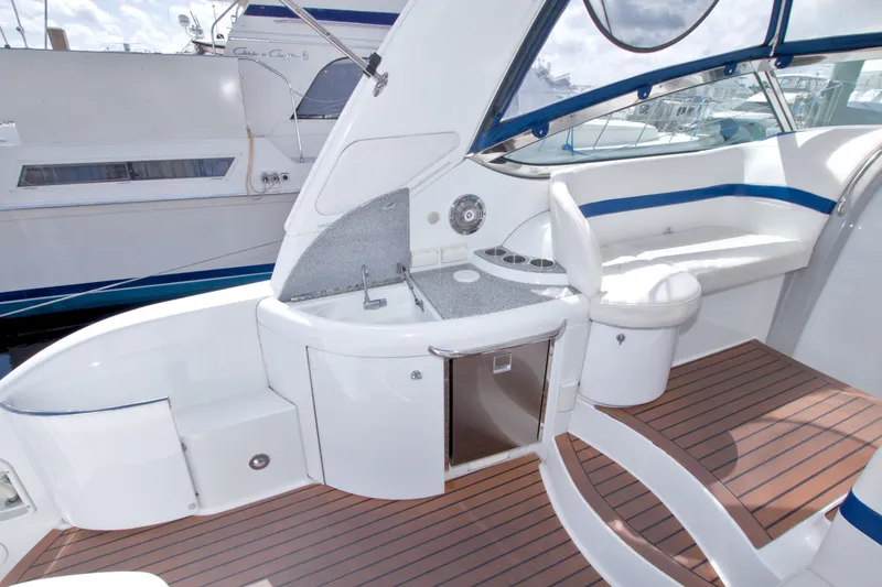 Slide: The Image of 2008 Formula 40 Performance Cruiser cockpit with seating, sink, and wood flooring. - 18