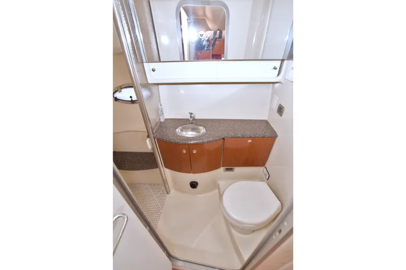 Slide: The Image of 2008 Formula 40 Performance Cruiser bathroom with sink, toilet, and storage cabinets. - 45