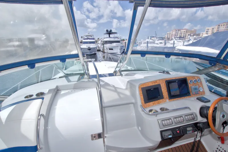 Slide: The Image of Cockpit view of 2008 Formula 40 Performance Cruiser at marina, featuring navigation controls. - 24