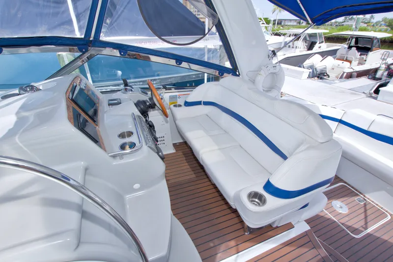 Slide: The Image of 2008 Formula 40 Performance Cruiser cockpit with white seating and modern controls. - 21