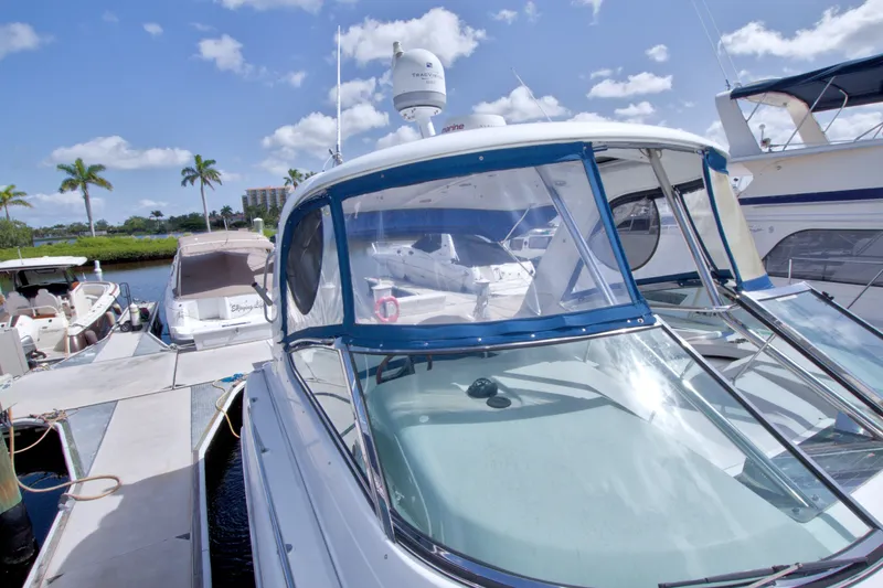 Slide: The Image of 2008 Formula 40 Performance Cruiser docked at marina under clear blue sky. - 30