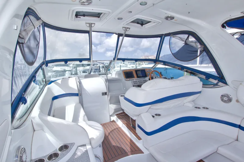 Slide: The Image of Interior of 2008 Formula 40 Performance Cruiser with white seating and blue accents. - 19
