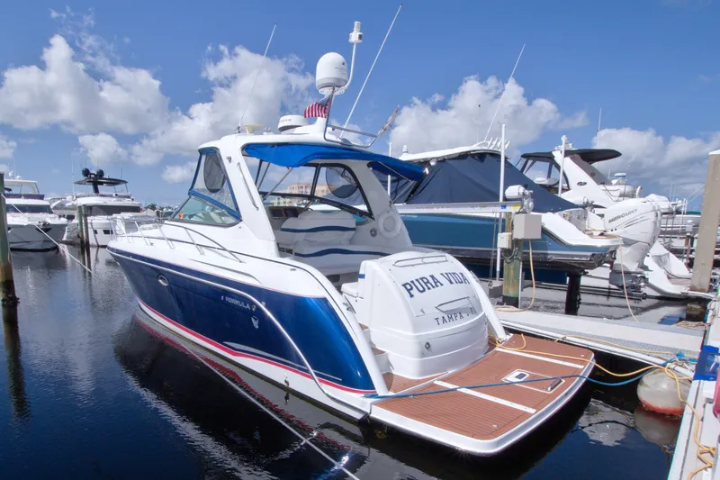 Slide: The Image of 2008 Formula 40 Performance Cruiser docked at marina under blue sky. - 13