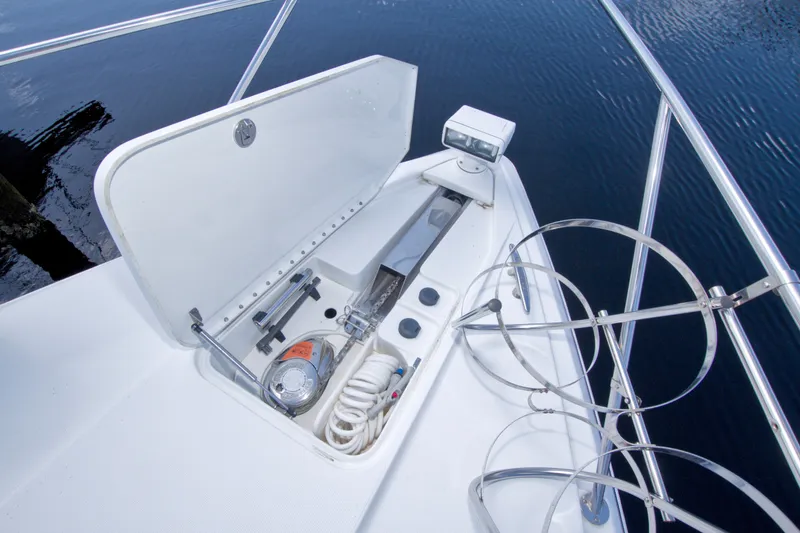 Slide: The Image of 2008 Formula 40 Performance Cruiser bow with anchor storage and railing on calm water. - 26