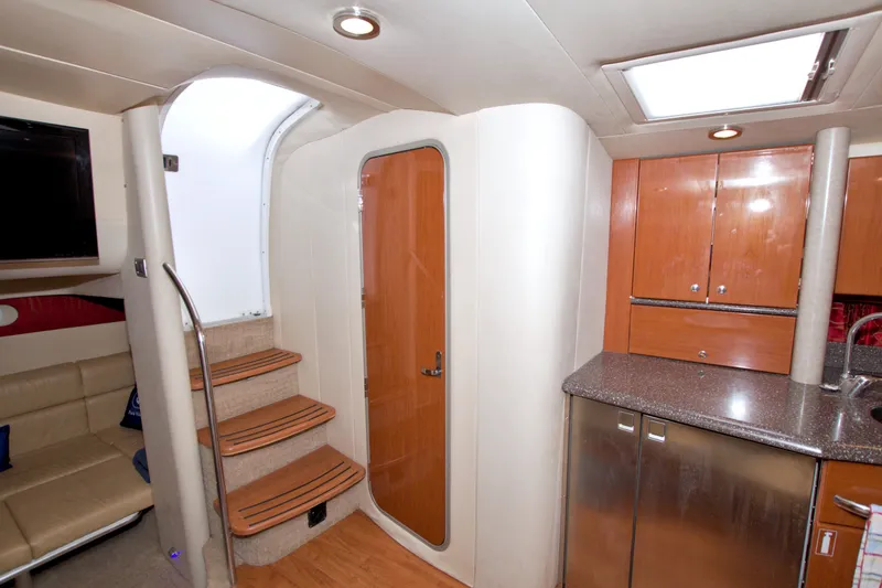 Slide: The Image of Interior of 2008 Formula 40 Performance Cruiser with stairs, kitchenette, and seating area. - 44