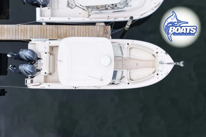 Slide: The Image of Overhead view of 2023 Grady-White Freedom 255 boat docked with twin engines. - 13