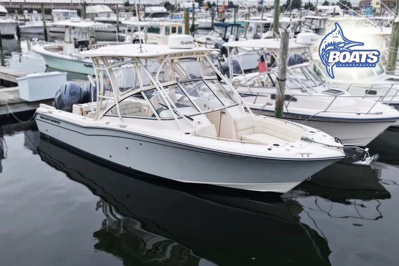 The Image of 2023 Grady-White Freedom 255 boat docked at marina, featuring sleek design and modern amenities. - 0