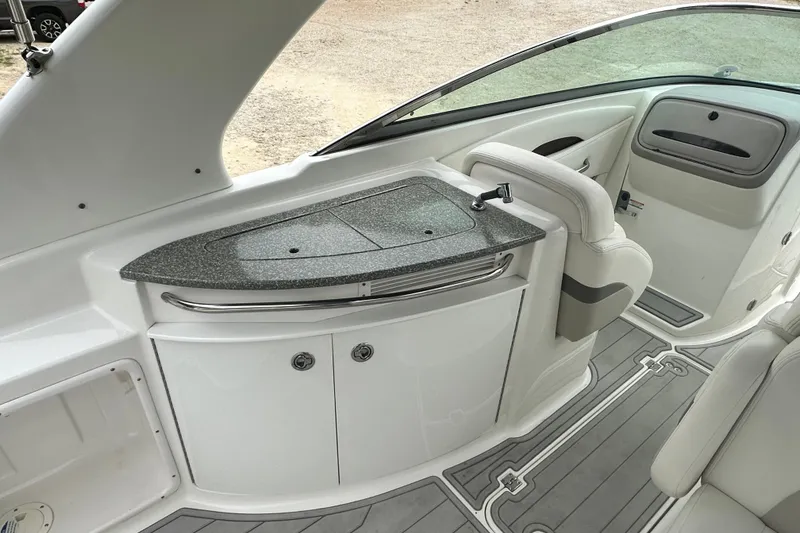 Slide: The Image of 2007 Chaparral 276 SSX boat interior with sleek countertop and seating area. - 9