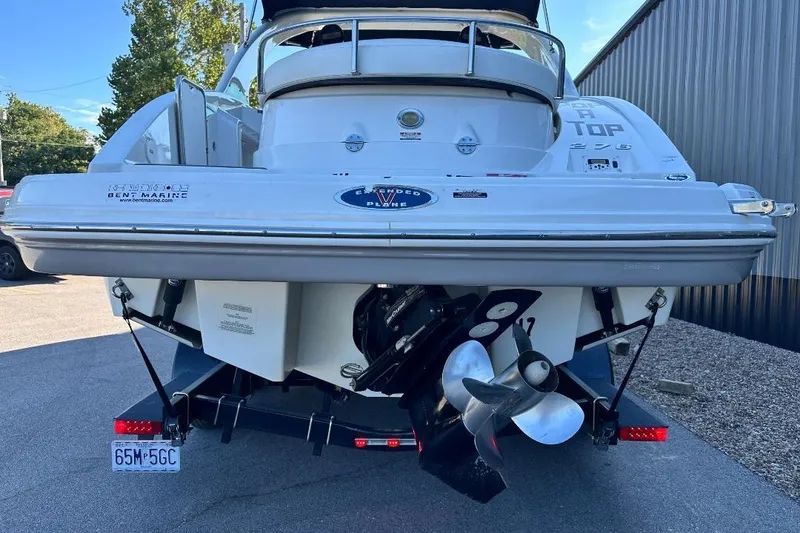 Slide: The Image of 2007 Chaparral 276 SSX boat rear view with dual propellers and trailer. - 3