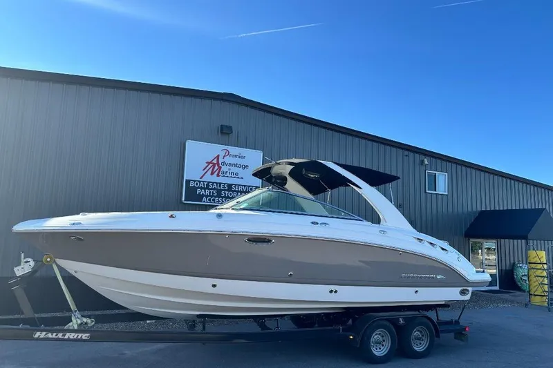 Slide: The Image of 2007 Chaparral 276 SSX boat on trailer outside marine dealership. - 0