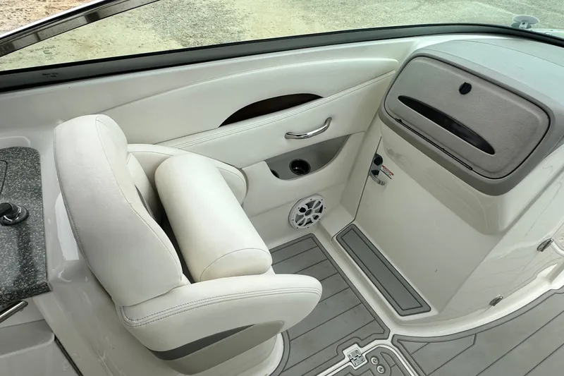 Slide: The Image of Interior of 2007 Chaparral 276 SSX boat with white seating and sleek design. - 10