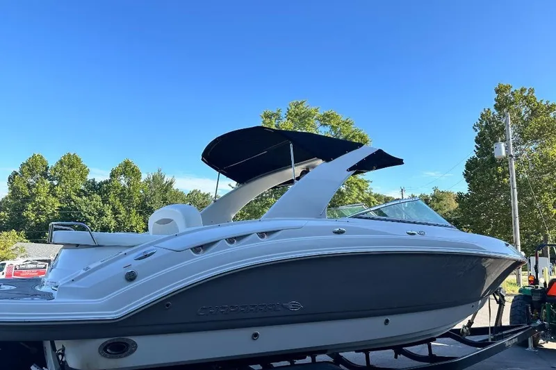 Slide: The Image of 2007 Chaparral 276 SSX boat on trailer, under clear blue sky. - 5