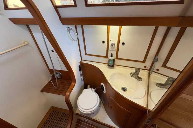 Slide: The Image of Compact 1989 Cambria 44/46 yacht bathroom with wooden accents and modern fixtures. - 26