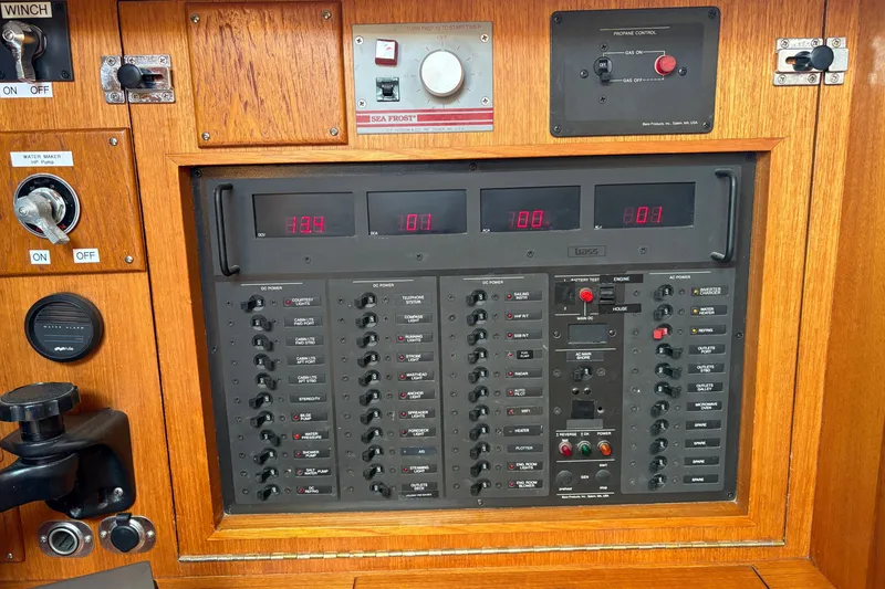 Slide: The Image of Electrical control panel on a 1989 Cambria 44/46 yacht, featuring switches and gauges. - 30