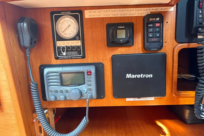 Slide: The Image of 1989 Cambria 44/46 yacht control panel with communication and navigation equipment. - 29